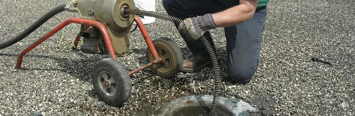 sewer rodding technician actively removing blockages from a sewer line in Memphis, TN